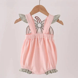 A baby girl's pink bubble romper with olive green ruffled shoulder and leg trim, hanging on a wooden hanger with a butterfly graphic insert, set against a plain light background.