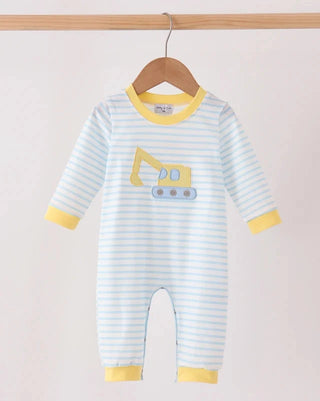 A baby long-sleeve footless romper with light blue and white horizontal stripes, yellow trim on the collar, cuffs, and hems, and a yellow excavator graphic on the chest, hanging on a wooden hanger.