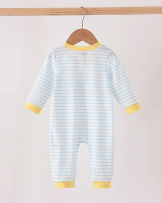 A baby long-sleeve footless romper hanging on a wooden hanger from a wooden rod, featuring light blue and white horizontal stripes with yellow trim at the collar, cuffs, and hem.