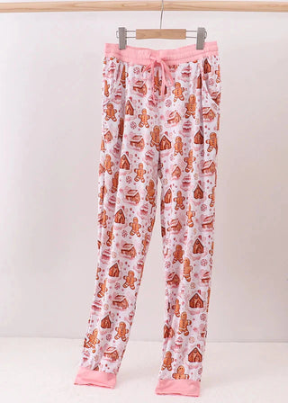 Floral pajama pants with gingerbread men pattern on a white background