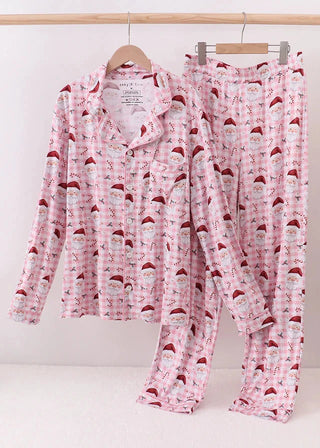 Pink pajama set with Santa Claus pattern on a white background