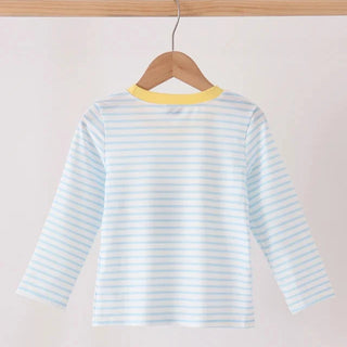 A light blue and white striped long-sleeve baby top hanging on a wooden hanger against a plain off-white background.