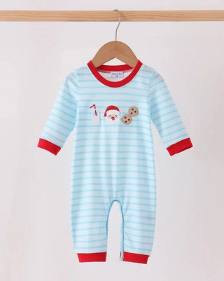 A baby long-sleeve footless romper hanging on a wooden hanger, featuring light blue and white horizontal stripes with red trim on the collar, cuffs, and hem. The chest has a small festive graphic of Santa, a milk bottle, and cookies.
