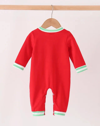 A red long-sleeve baby jumpsuit hanging on a wooden hanger against a light pink background. The jumpsuit features mint green and white striped trim at the crew neck, cuffs, and ankle openings.