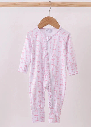 Baby onesie with pink designs on a hanger against a white background