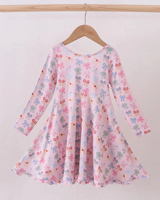 Floral dress on a hanger against a white background