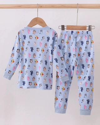 Children's pajama set with animal pattern on a hanger against a white background