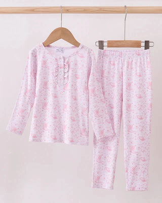 Floral pajama set on hangers against a white background