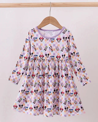 Children's dress with cartoon character print on a hanger against a white background