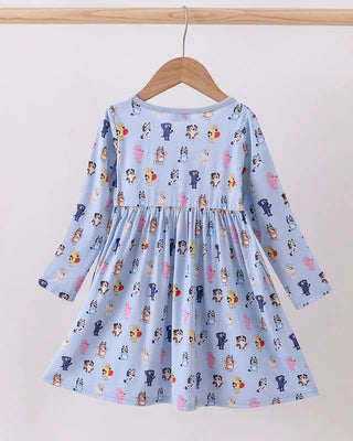 Children's dress with character print on a hanger against a white background