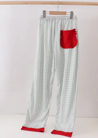 Plaid pajama pants with a red pocket and trim on a white background