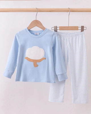 Children's outfit set with a blue top and checkered pants on a hanger against a light background.