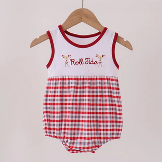 A baby romper hanging on a wooden hanger against a light beige wall. The romper has a white upper section with red trim and 'Roll Tide' text with small giraffe graphics, and a red and white gingham checkered lower section.