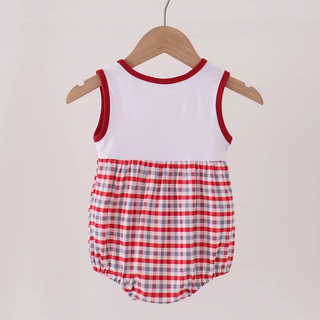 A baby romper hanging on a wooden hanger against a plain light background. The romper has a solid white upper bodice with red trim, and a red and white gingham checkered lower section.