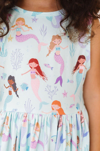 Dress with mermaid pattern on a light blue background