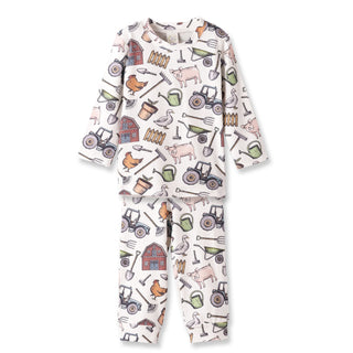 Children's pajama set with farm-themed pattern on a white background