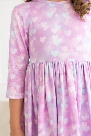 Pink dress with heart pattern worn by a person