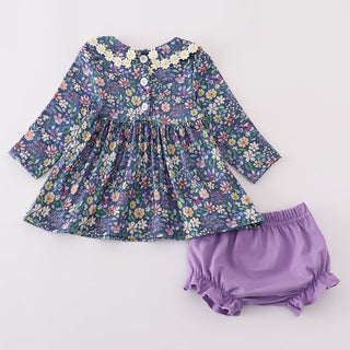 Floral dress and purple bloomers on a white background