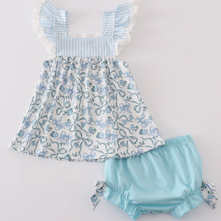Children's floral dress with matching bloomers on a light gray background