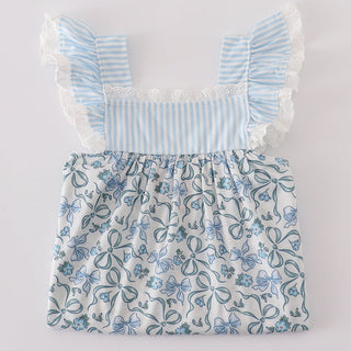 Toddler top with blue floral pattern and ruffled sleeves on a white background