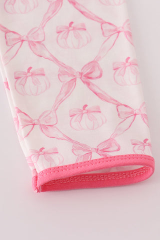 Close up of arm sleeve with pink bows print 
