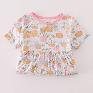 Baby outfit with pumpkin pattern on a light gray background