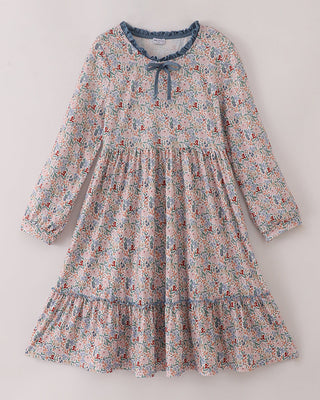 Floral dress with long sleeves on a light gray background