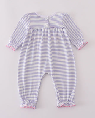 Striped baby romper with pink trim on a light gray background