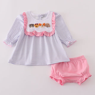 Baby top with ruffled collar and pink bloomers on a light gray background
