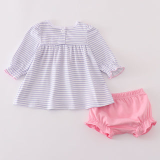 Striped top and pink bloomers on a light gray background