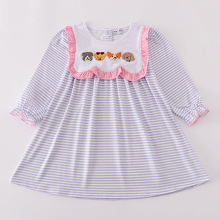 Striped dress with embroidered details on a light gray background
