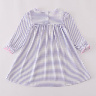 Striped dress with long sleeves on a light gray background