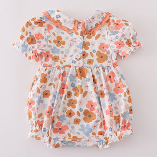 Floral baby dress on a light gray background