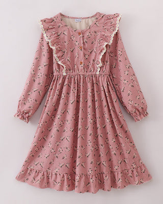 Pink floral dress with ruffled details on a white background