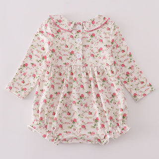 Floral baby romper on a light gray background