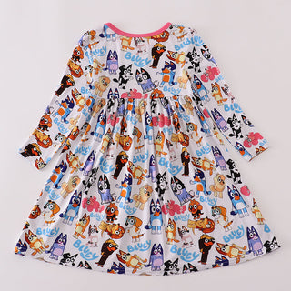 Children's dress with dog character print on a light gray background