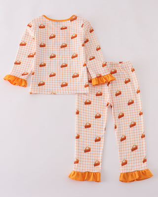 Children's pajama set with pumpkin pattern on a light gray background