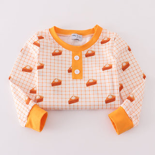 Children's long-sleeve shirt with orange pies and checkered  pattern on a light gray background