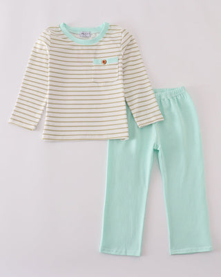 Children's outfit with striped shirt and mint green pants on a light gray background