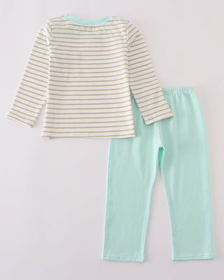 Striped long-sleeve top and mint green pants on a light gray background