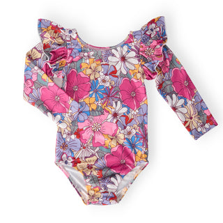 Floral patterned leotard with long sleeves on a white background