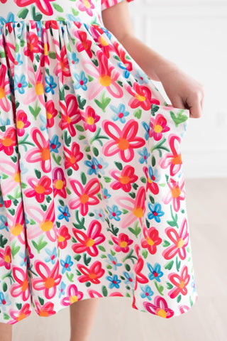 Colorful floral dress with a white background