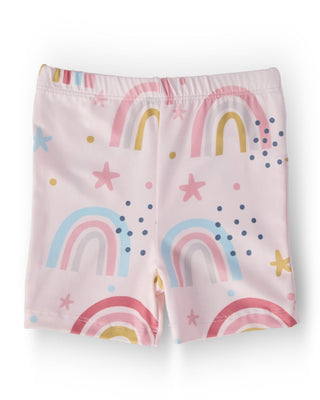 Children's shorts with rainbow and star pattern on a light pink background