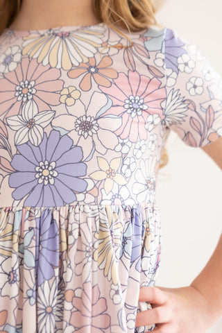 Close-up of a floral dress with pastel colors