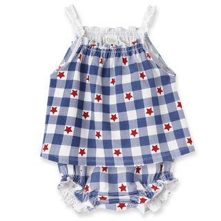 Baby romper with blue and white checkered pattern and red stars on a white background