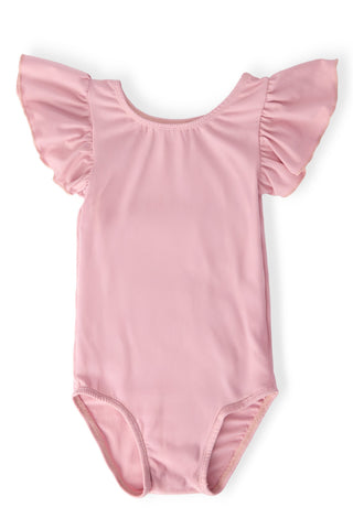 Pink leotard with ruffled sleeves on a white background