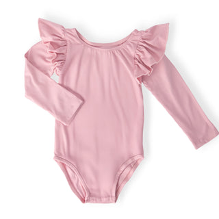Pink long-sleeve leotard with ruffled shoulders on a white background